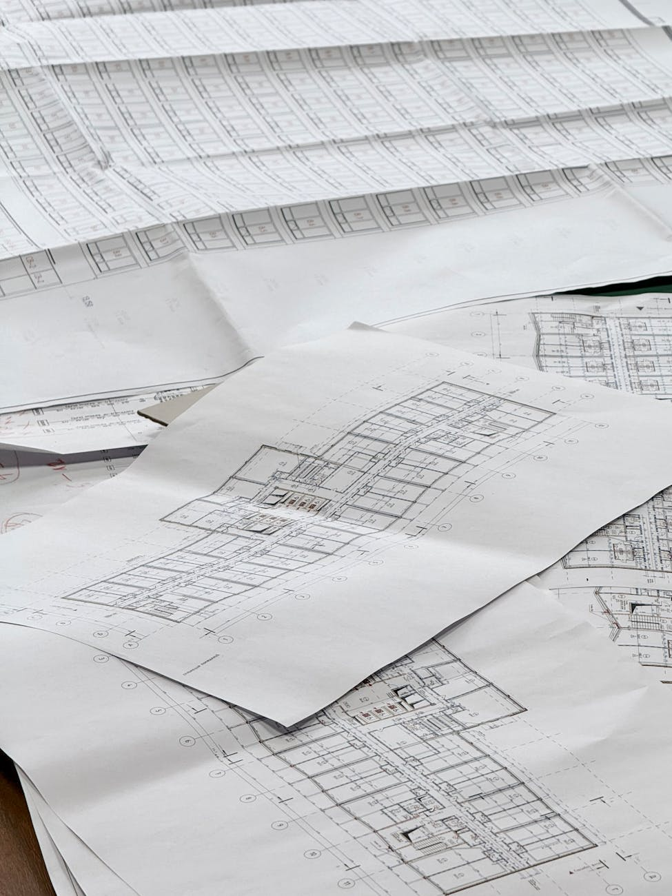 detailed architectural blueprints on desk